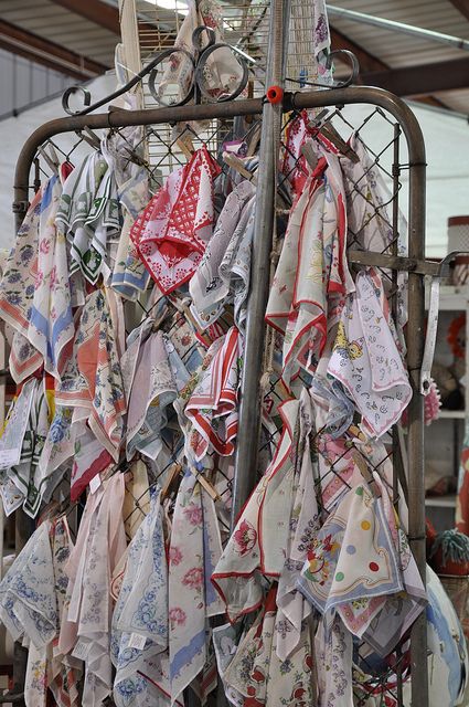 Vintage hankies displayed on old gate - via vickiemarie